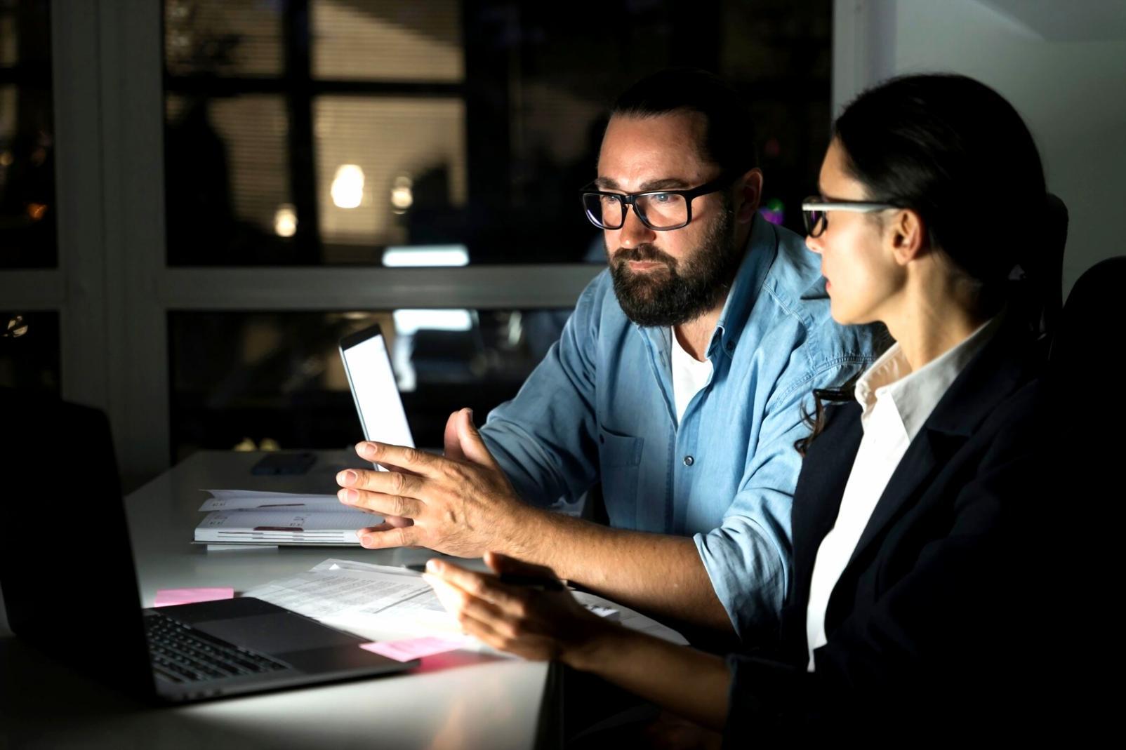 Modern workspace showing expense categorization process with organized financial documents