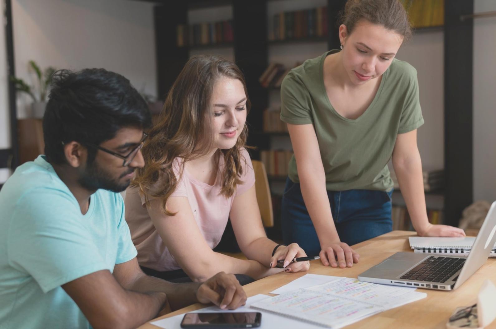 Study materials and expense tracking guides spread across desk